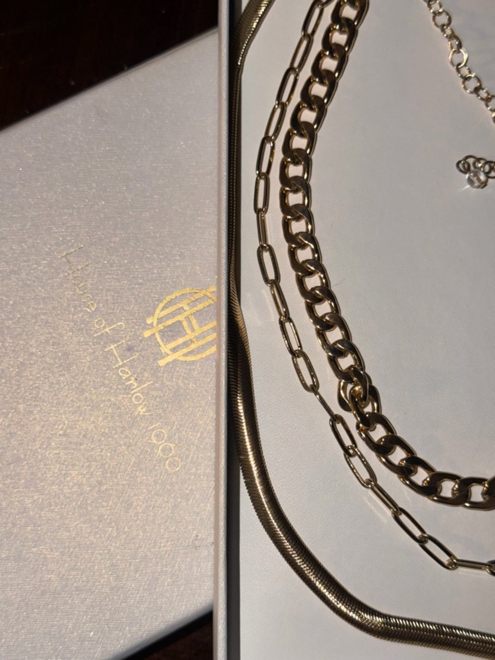 House of Harlow 1960 Logo Plaque in Gold on Pale Background